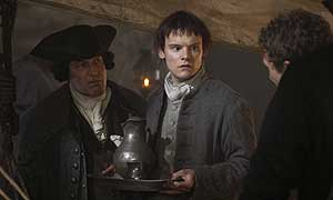 Captain Hoseason (Gavin Richards) and Ransome (Jake Lindesay) persuade Davie Balfour (James Anthony Pearson) to take the poisoned wine to Alan Breck