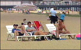 Pic: people on Yarmouth Beach.