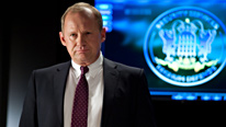 Harry (Peter Firth) is furious