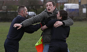 The referee intervenes as Terry McConnell (Steve Edge) confronts the linesman © Hartswood Films/Matt Squire 