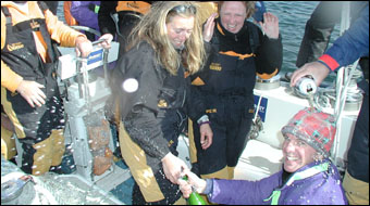 Champagne corks pop at the finish line.