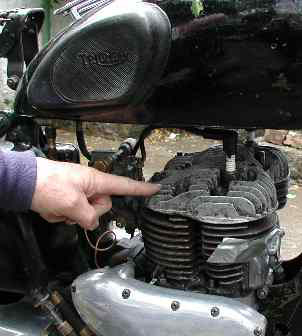 Willie points to the typical flat cylinder-head of a side-valve engine.