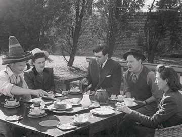 The art historian David Sylvester at tea with the Moores and the sculptor Reg Butler and his wife, Jo, in 1947. Photo by Felix H. Man © The Henry Moore Foundation. This image must not be reproduced or altered without prior consent from the Henry Moore Foundation.