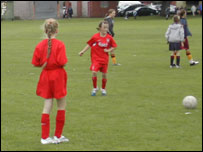 Girls playing football