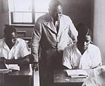 A teacher attends to students