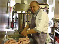 Kevin making sausages