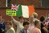 Image of opposing communities on the Ormeau Road flying flags