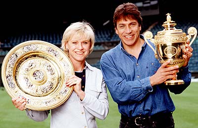 Sue Barker and John Inverdale hold the Wimbledon trophies