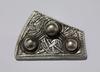 Silver fragment of a Viking brooch, decorated with an interlaced animal motif. (c) Trustees of the British Museum Silver fragment of a Viking brooch, decorated with an interlaced animal motif. (c) Trustees of the British Museum
