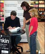 Ian Rankin signing books