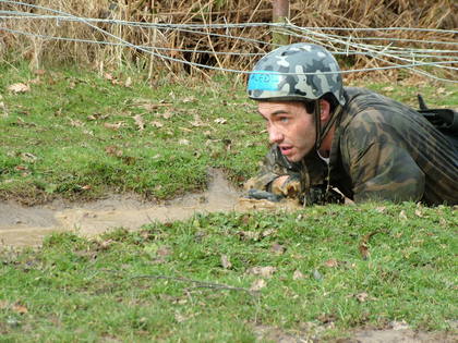 Aled crawling through mud
