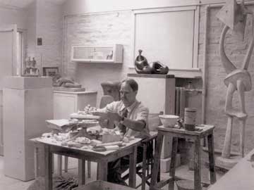 Moore in his maquette studio 1952, photo by The Henry Moore Foundation Archive © The Henry Moore Foundation. This image must not be reproduced or altered without prior consent from the Henry Moore Foundation.