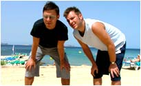 The boys pose on the beach
