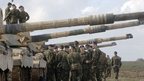 Soldiers and tank