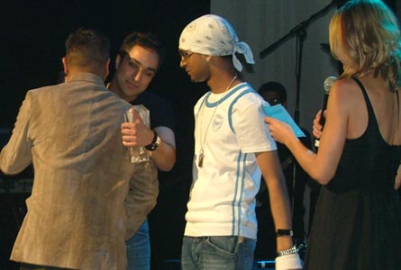 Navin is congratulated by Rishi Rich