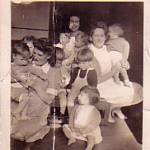 Me Margaret Maisey holding Georgie,I am wearing a white apron at nursery,with Sister Evans and Nurse Collins. Stoke on Trent - June 1943 Me Margaret Maisey holding Georgie,I am wearing a white apron at nursery,with Sister Evans and Nurse Collins. Stoke on Trent - June 1943