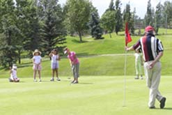 Girls playing golf