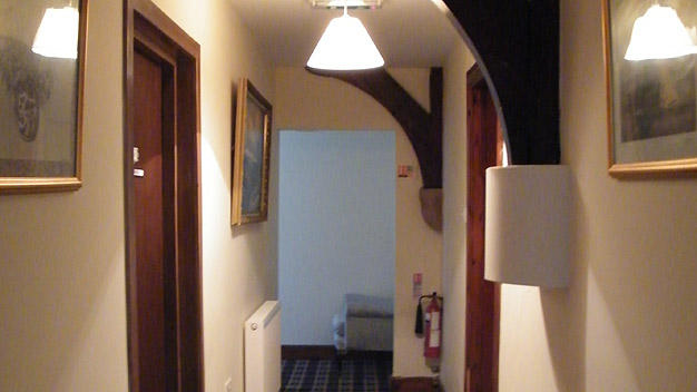A hall way leading to bedrooms within the convent