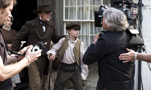 (L-R) Deborah Findlay as Miss Tomkinson, Philip Glenister as Mr Carter and Alex Etel as Harry Gregson on set filming Cranford