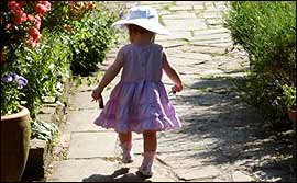 Pic: Toddler walks along path.