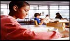Child sitting correctly at his desk