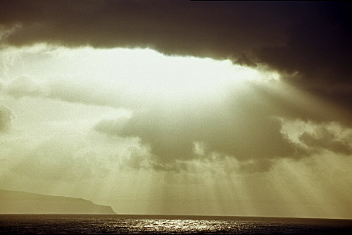 Sunlight through the clouds from Portstewart looking out to Donegal