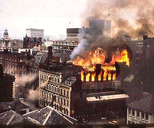 Photo taken by Dick Macmillan in 1970s of Belfast's Linenhall Street with a building on fire