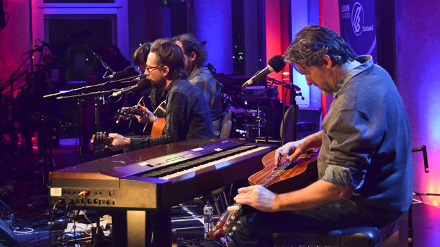 Jay Farrar, Anders Parker, Will Johnson and Mark Spencer performing Woody Guthrie songs.