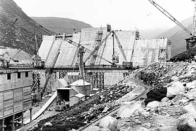 The dam construction at an advanced stage of completion around 1955