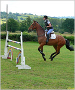 Angie and Bradley approach a jump
