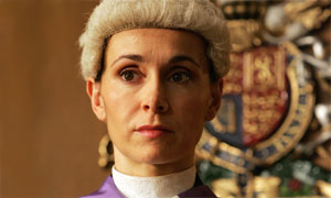 Joanna Roth plays Judge Newland