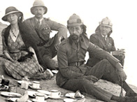 A photograph showing Gertrude Bell, influential adviser to the British administration, on a picnic outside Baghdad, with King Faisal I
