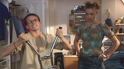 Michael tests his muscles in front of Abi