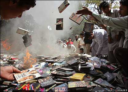 Students burn DVDs and books