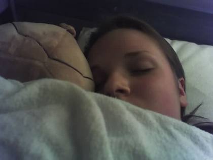 Someoen sleeping with American Football.
