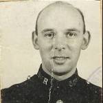 Photograph of Louis Sheppard in Police uniform from his wartime identification card Photograph of Louis Sheppard in Police uniform from his wartime identification card
