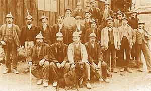 The miners of Wotherton pit.  Note the candles, stuck to their helmets using lumps of clay.