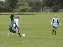 Girls playing football