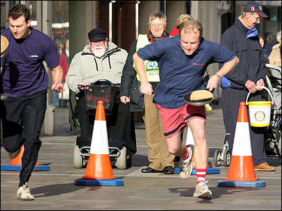 Howard Bentham in the pancake race