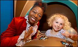 Floella Benjamin shown with young visitor