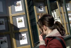 Woman outside estate agent