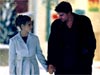 Buffy and Angel hold hands in the Snow. Aaah.