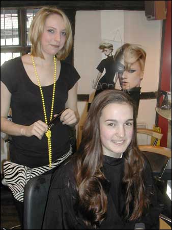 Girl at the hairdresser with stylist