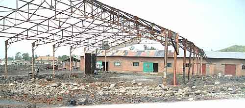 Rebuilding a hospital wing which volcano lava had destroyed in 2002