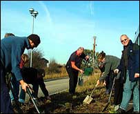 Volunteers dig gardens at Bluebell wood hospice