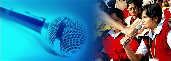 Microphone and school children debating