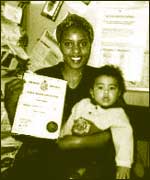 Woman with baby and certificate