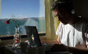 Producer Alexis Condon at work en route