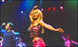Pic: Sophie Lawrence and the cast dancing.