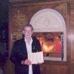 Harold Limeburner holding the Roll of Honour open to the page of his brother Jack's name. Harold Limeburner holding the Roll of Honour open to the page of his brother Jack's name.